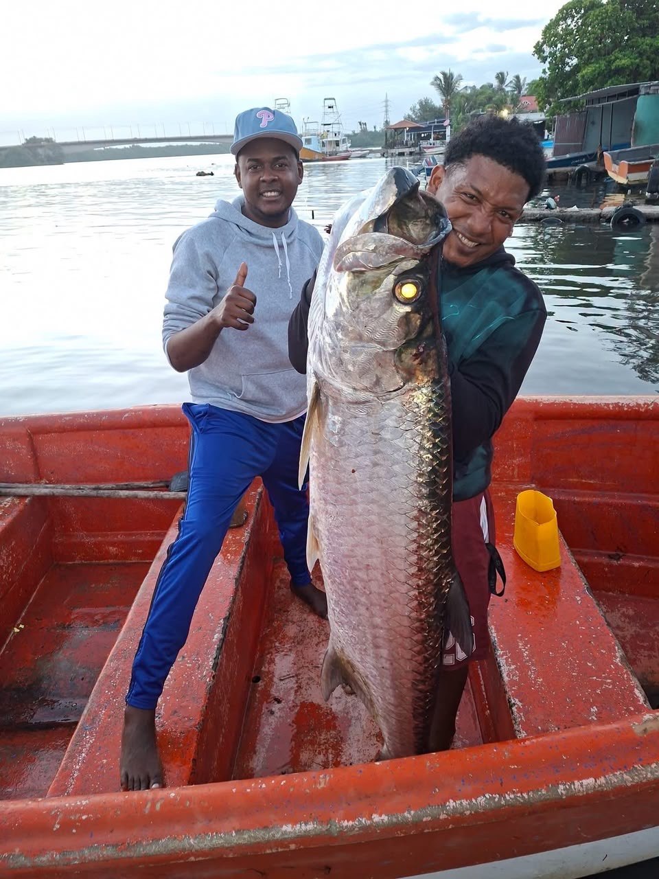 Guests with a large tarpon catch on the fishing tour