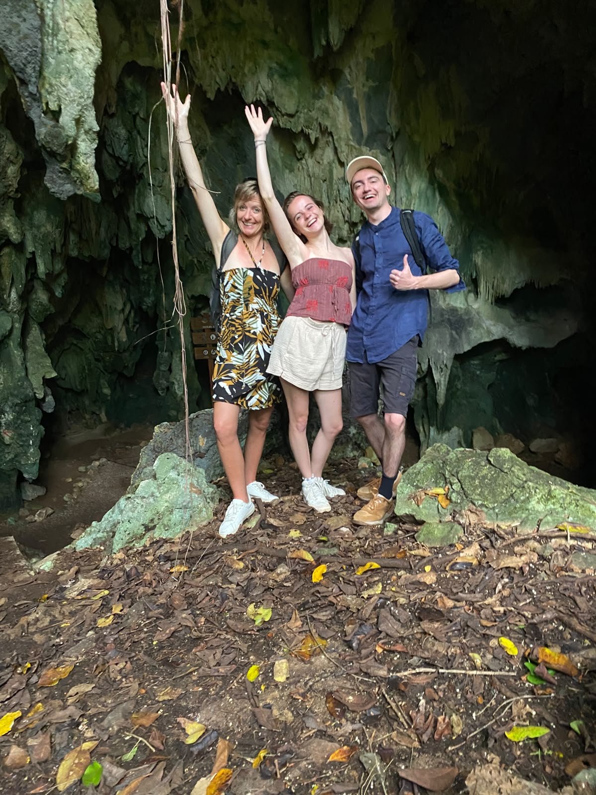 Friends celebrating inside a cave