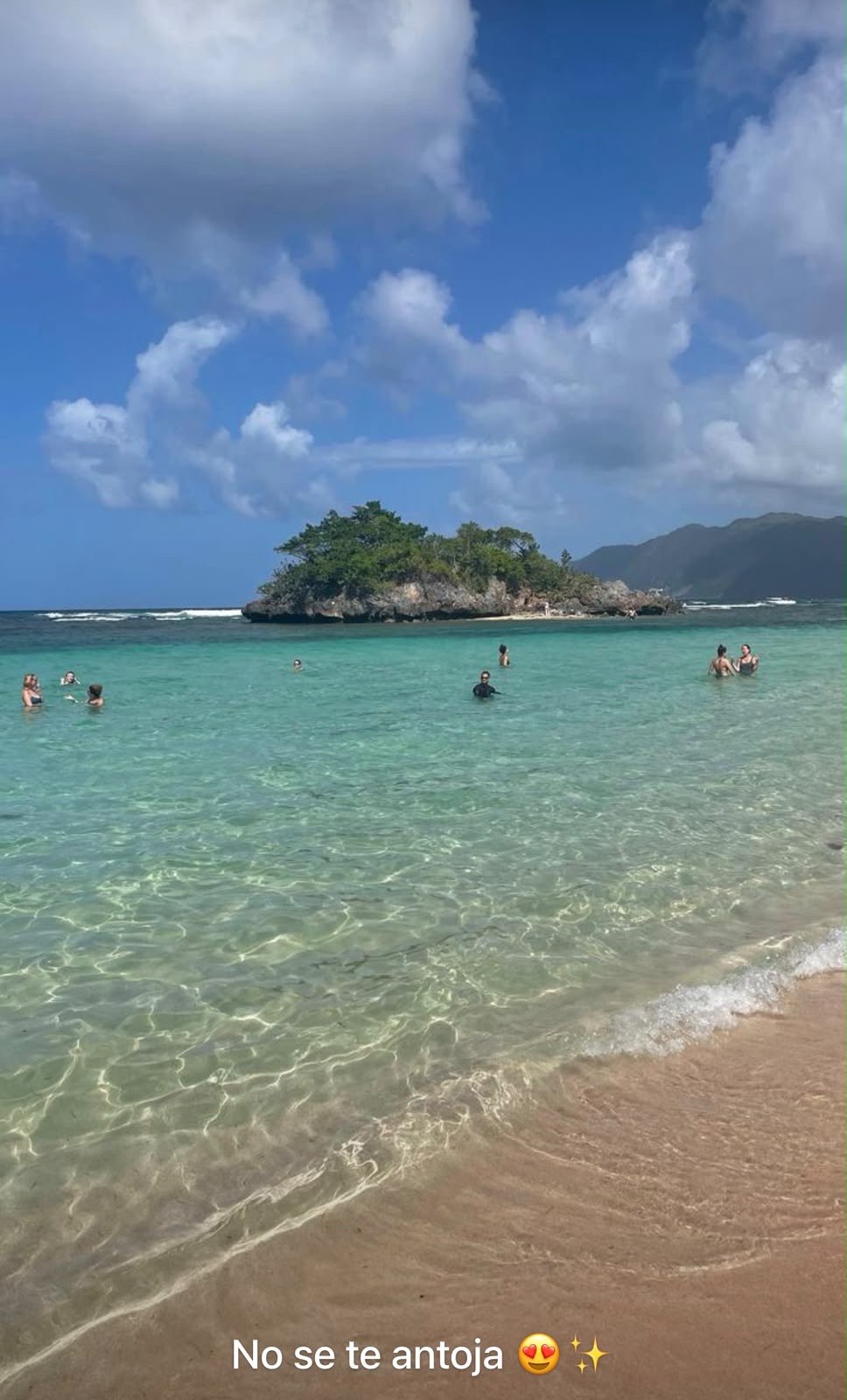 Playa Emitaño, crystal-clear water and a small rocky islet